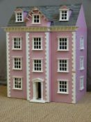 A fully furnished doll's house with pink exterior and slate roof, 85x73x50cm.