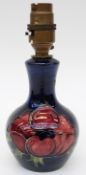 Moorcroft lamp in Anemone pattern on a blue ground,