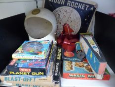 A collection of space related toys and games including NASA spacesuit helmet, Waddingtons Blast-Off,