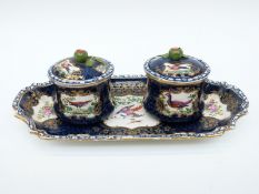 A 19thC porcelain double inkwell/ standish, the wells with leaf finials,