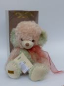 Merrythought Cheeky Teddy bear with green and pink mohair, pink ribbon and jointed limbs,