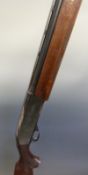 Remington model 1100 12 bore semi-automatic shotgun with ornately carved semi-pistol grip and