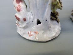 A pair of Bow porcelain figures Hunter and Huntress, both holding guns,