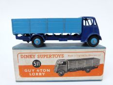 Dinky Supertoys diecast model Guy 4-Ton Lorry with dark blue cab and chassis and pale blue bed and