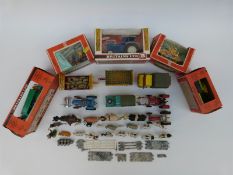 A collection of Britains and Corgi diecast model vehicles and farm accessories,