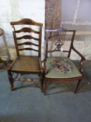 A late 19thC inlaid mahogany armchair and a ountry ladder back chair