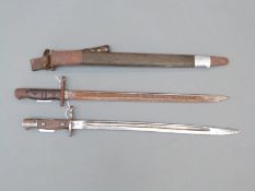 Two WWI American M17 bayonets, one with scabbard,