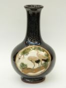 A Japanese pedestal vase hand decorated with cranes, incised mark to base,