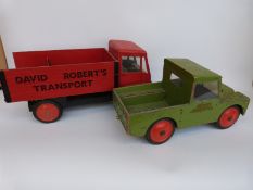 Two large scale wooden models of a Land Rover the other of a vintage lorry,