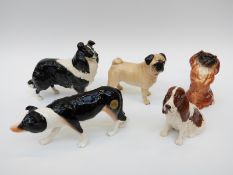 Four Beswick dogs comprising Pug, Pekingese,
