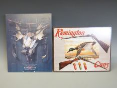 Two metal advertising/ shop display signs 'We Recommend and Sell Winchester Cartridges and Guns',