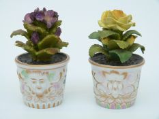 Two porcelain models of flower pots with red anchor mark to the bases