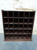 A 19thC mahogany pigeon hole unit with campaign style handles W65 x D19 x H69cm