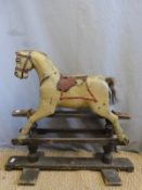 A 19thC painted wood carousel style rocking horse,