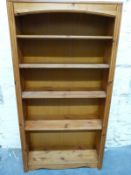 A pine bookcase with adjustable shelves,