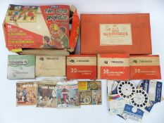 Five vintage 3D View-Masters together with a Merit Ace projector,