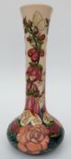 Moorcroft bottle vase decorated with foxgloves and flowers,