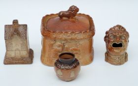 Four 19thC salt glazed items including an unusual grotesque head spoon warmer, money box,