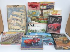 Eleven Airfix and other kits including six model car kits,