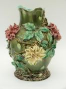 A Victorian majolica vase with applied flowers,