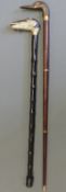 Two walking sticks, one carved and painted in the form of a ram,