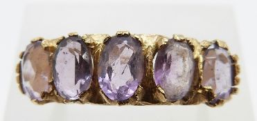 A 9ct gold ring set with five oval amethysts, size K, 3.