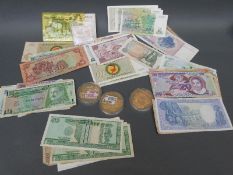 Over fifty world bank notes to include UK, Scotland, USA etc, one trio and one pair,