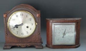 A c1930 oak cased mantel clock with Arabic numerals, the two train movement striking on a gong,