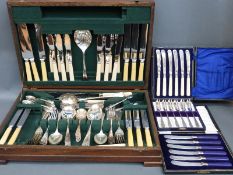 An oak cased canteen of silver plated cutlery and three boxed sets of knives