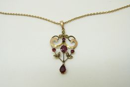 An Edwardian pendant set with garnets and seed pearls, 4.