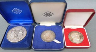 Two cased John Pinches of London silver Royal commemorative medal coins,