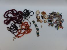 A collection of cherry amber, silver brooches set with cameos, agate necklace, jet necklaces,