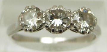 A platinum ring set with three round brilliant cut diamonds, each approximately 0.45ct, size L/M, 6.
