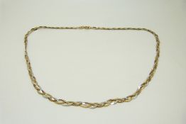 A 9ct gold tri-coloured plaited necklace,