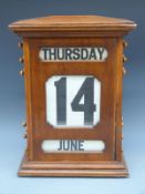 A large early 20thC mahogany haberdashery / office / factory or shop perpetual calendar,