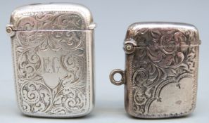 Two Victorian hallmarked silver vestas both with engraved decoration, Birmingham 1896 and 1899,