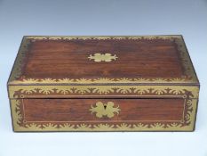 A 19thC brass inlaid rosewood writing slope with embossed leather interior and campaign handles,