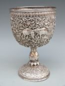 Indian white metal goblet with embossed decoration of elephants, deer, buffalo and lion,