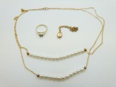 A yellow metal ring marked 585 set with a zircon (1.