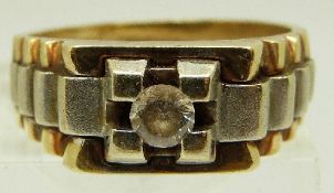 A 14ct gold ring of stepped bi-coloured design set with a diamond of approximately 0.