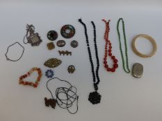 A collection of costume jewellery including Miracle brooch, silver brooch, unusual silver pendant,