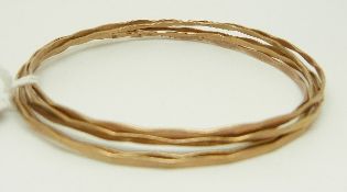 Five 9ct gold bangles, 12.
