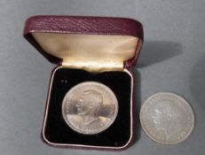 1935 George V rocking horse crown together with a cased 1951 Festival of Britain example