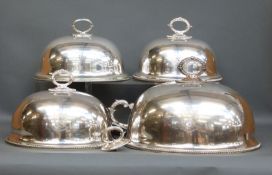 A graduated set of three Walker & Hall silver plated meat or serving domes,