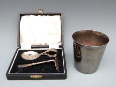 Cristofle plated beaker and a hallmarked silver pusher and plated spoon set