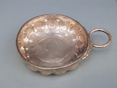 A French white coin based tastevin, with French silver marks, length 11cm,