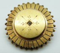 A yellow metal Victorian mourning brooch set with an old cut diamond,
