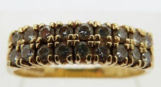 An 18ct gold ring set with diamonds totalling 0.44ct in two rows, size O, 3.