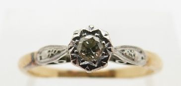 An 18ct gold ring set with a diamond in a platinum illusion setting, size N, 2.