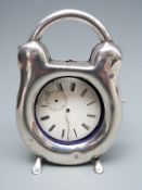 An early 20thC hallmarked silver novelty pocket watch holder formed as a padlock,